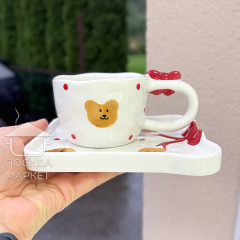 Чашка з блюдцем 220 мл "Банти і мішки" ручної роботи білого кольору, кераміка